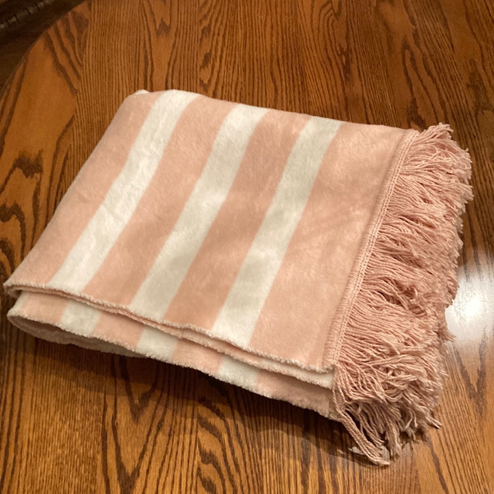 Pink and white fleece throw